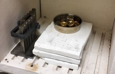 Moulds and metal being warmed so the pour starts with less thermal shock and more predictable flow